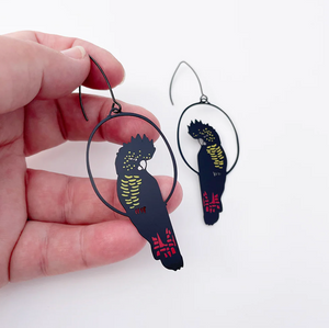 DENZ "Red Tailed Black Cockatoo" dangles statement earrings